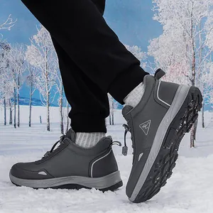 Grey winter hiking boots for seniors featuring fleece lining and non-slip soles on snow
