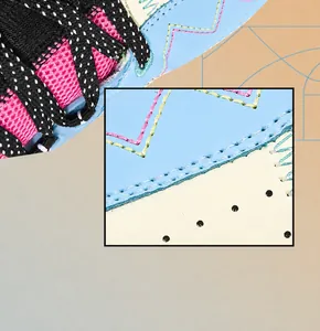 Detail of blue leather upper with contrast stitching and polka dot laces for court sneakers