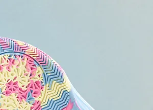 Macro detail of multi-color non-slip rubber sole with lateral support patch for stability