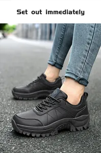 Close-up of black leather hiking shoes featuring thick non-slip soles and stitching detail