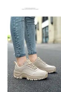 On-foot view of beige chunky platform hiking sneakers with rugged anti-slip soles