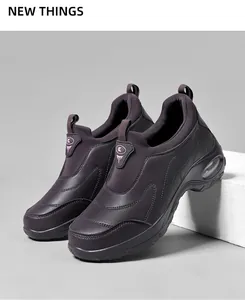 Detail of slip-on breathable sneakers showing air cushion sole and purple knit upper