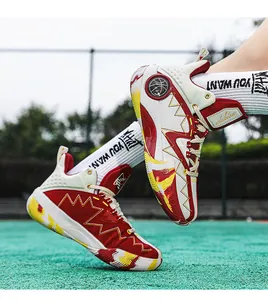 Macro detail of high-top basketball sneaker with red and yellow leather stitching