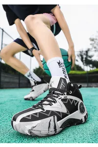 Low-angle shot of high-top casual sneakers with wave patterns and splatter design