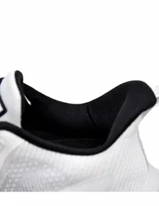 Detail view of the white mesh sneaker showing breathable fabric and soft foam lining