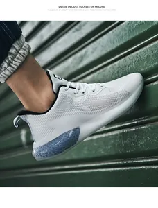 Detail of white mesh running shoe featuring a blue honeycomb cushioning air unit at heel