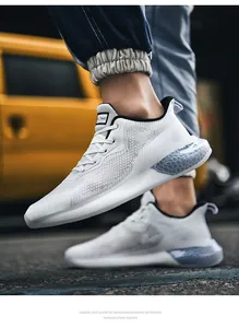 Detail view of white mesh running shoe with blue translucent honeycomb cushioning sole