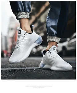 Close-up of white breathable mesh running shoes with light blue honeycomb heel detail