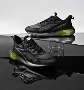Detailed macro view of black breathable mesh running shoe with neon green accent scales