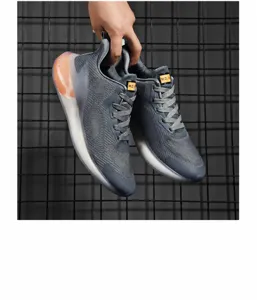 Close-up of grey knit sneakers featuring breathable mesh and translucent white thick soles