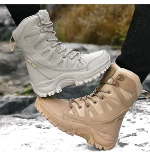 Close-up of durable high-top tactical hiking boots in beige and sand on rocky terrain