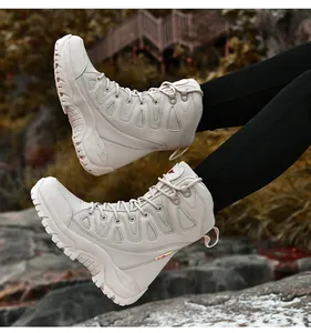 Detail view of sand beige tactical hiking boots with deep anti-slip rubber outsoles
