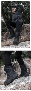 Close-up of black outdoor desert boots featuring red logo and anti-slip rubber sole