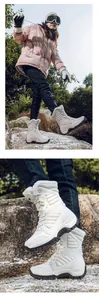 Detail of high-top white winter snow boots featuring warm fleece lining and thick black sole
