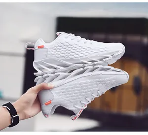 Detail view of white breathable mesh sneaker with mechanical blade cushioning sole structure