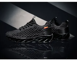 Detail of breathable mesh upper and blade sole on black athletic running shoes for men