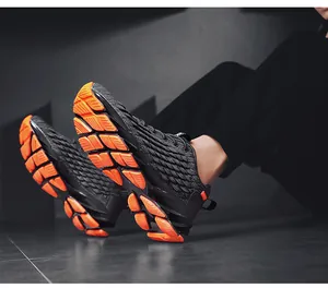 Detail view of breathable knit running shoes with vibrant orange modular tech soles