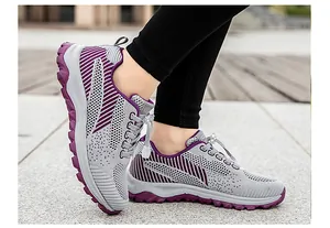 Detail of grey mesh walking shoes for seniors with purple accents and quick lace system