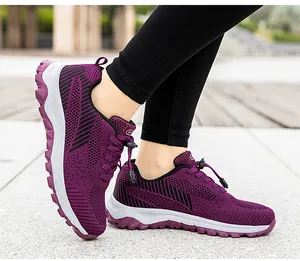 Detail of purple mesh walking shoes with black stripes and adjustable bungee laces