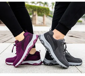 Detailed outdoor view of breathable mesh walking shoes with quick-lace system and thick sole
