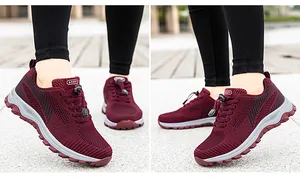 Close-up of wine red breathable mesh sports shoe with flexible elastic lacing system