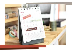 Detail of solid color washi tape rolls used on a minimalist coil calendar layout