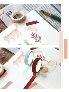 Close-up of colorful solid washi tapes on grid paper for DIY planner decoration
