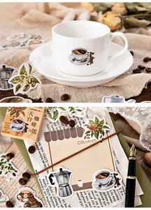 Close-up of vintage coffee themed stickers applied on a white ceramic mug and stationery