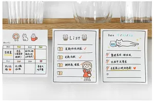 Detail of cute cartoon weekly planner and todo list sticky notes on a wooden stand