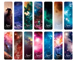 Flat lay of fourteen assorted celestial galaxy and nebula themed artistic bookmarks