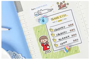 Detailed close-up of cute cartoon girl stickers and daily check list for journaling