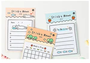 Close-up of pastel sticky notes with cat and forest illustrations and to-do list layout