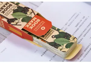 Detail of vintage floral bookmarks set with cherry illustrations in a pull-out paper box