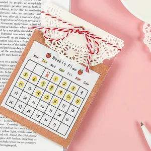 Creative weekly plan notepad with vintage lace decor and red cotton twine for journaling