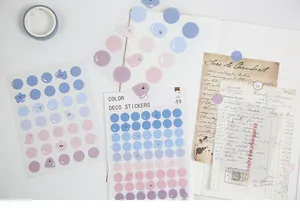 Flat lay of colorful deco stickers with ghost and cloud shapes for artistic DIY journaling