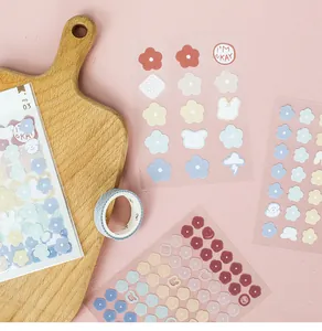 Close-up of decorative summer theme stickers featuring cute floral and animal illustrations
