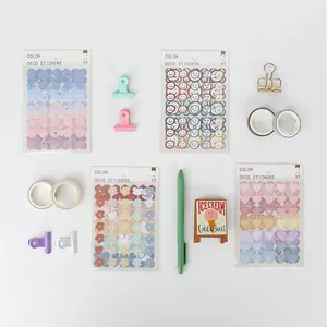 Flat lay of colorful deco stickers with heart and flower motifs for DIY journaling