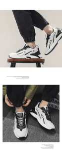 Detailansicht der klobigen Herren-Mesh-Sneaker in Schwarz-Weiß-Leder mit dicker Sohle