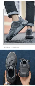 Detailed close-up of grey chunky men's sneakers with premium suede texture and stitching