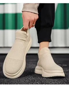 Detailed close-up of flexible beige knitted upper and elastic collar on sock sneaker