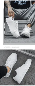 Macro shot of white leather sneakers featuring durable lacing and flat rubber soles