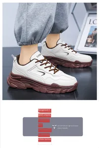 Détail de baskets blanches en cuir avec lacets marron et semelle épaisse antidérapante