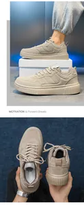 Detailed close-up of beige platform sneakers featuring thick ribbed rubber soles and lacing