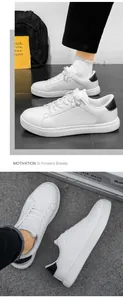 Detailed view of white casual sneakers featuring contrast black heel and anti-slip sole texture
