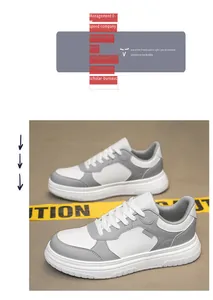 Détail de baskets basses blanc et gris en cuir synthétique avec semelle plateforme