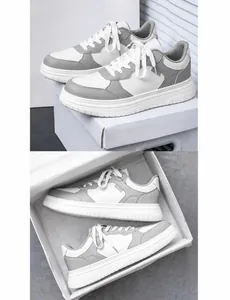 Vue détaillée des baskets à plateforme blanc et gris sur boîte avec lacets
