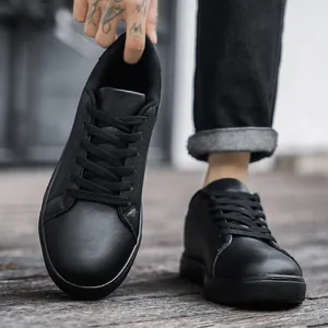 All-black men's minimalist leather sneakers with durable rubber sole for urban casual style