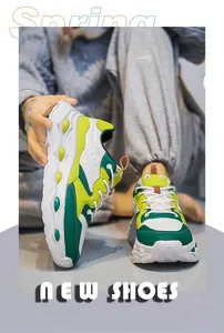 Detail view of stylish chunky sneakers featuring green and yellow color-block design