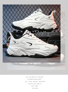 Detail view of stylish white and black chunky sneakers with thick soles and mesh fabric