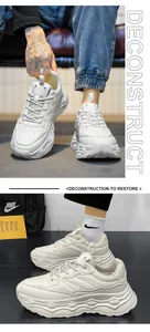 Detailed view of white platform sneakers for men showing layered construction and chunky sole